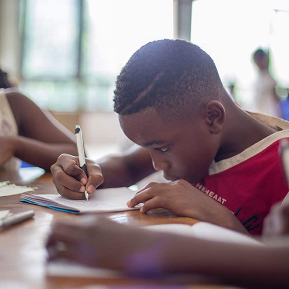 black male child writing
