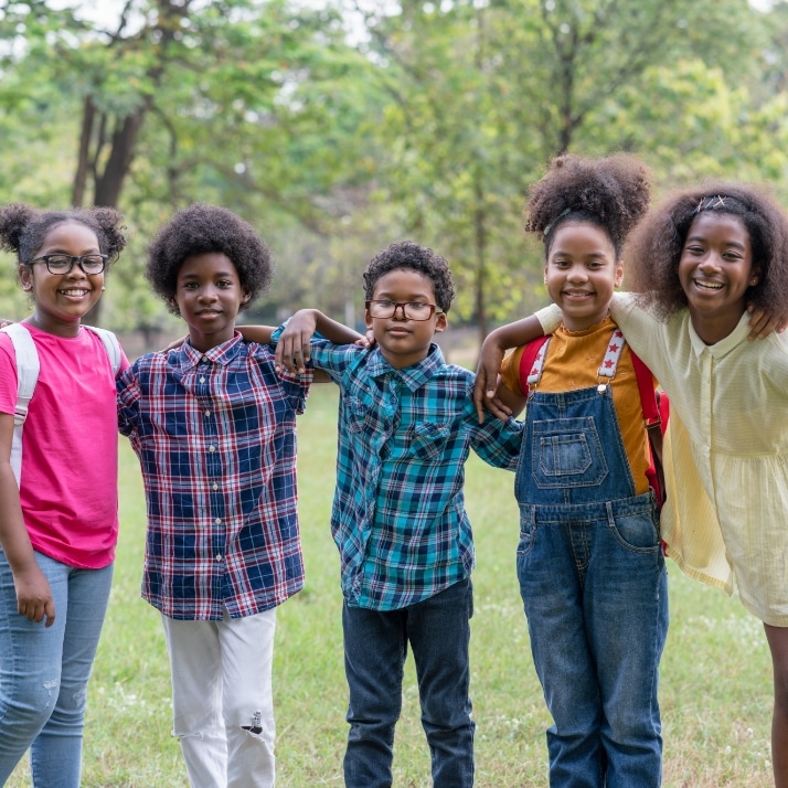 portrait african american childrens standing looking park